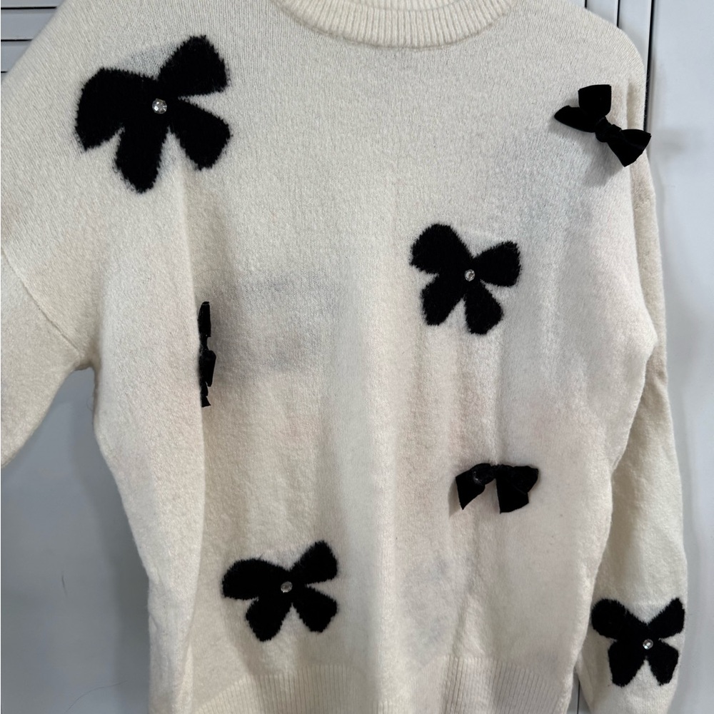 Cato Cream Crewneck Sweater with Black Bow Appliqués